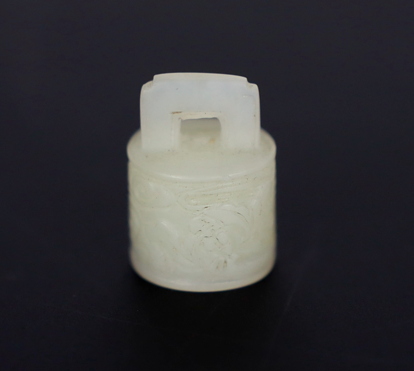 A Chinese miniature white jade seal of archaic bronze bell form, late Qing dynasty